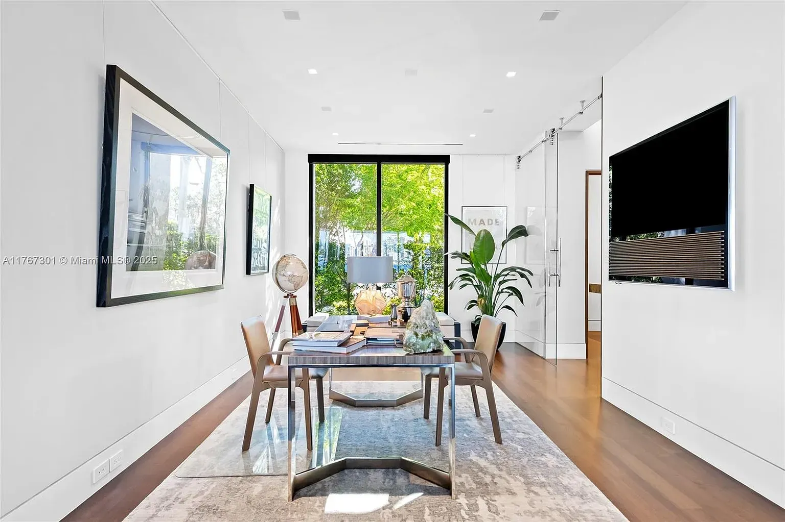 Airy office with floor-to-ceiling windows. I’d actually answer emails here.