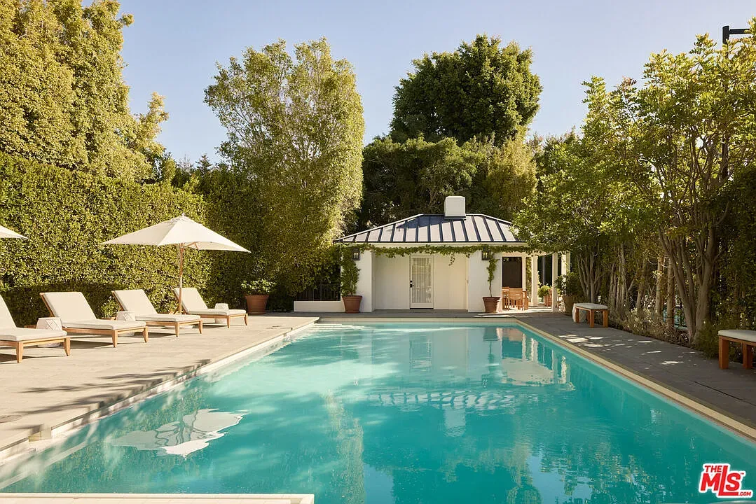 Turquoise pool, lots of greenery. Quiet resort energy.