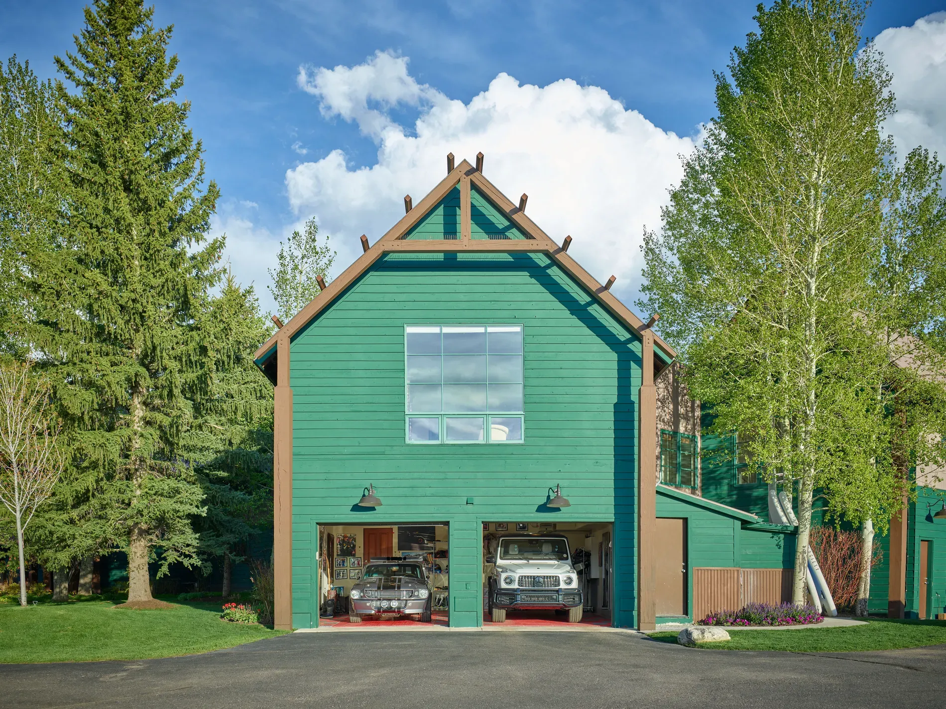 Okay, this lodge goes emerald with those oversize beams. Dramatic, but works.