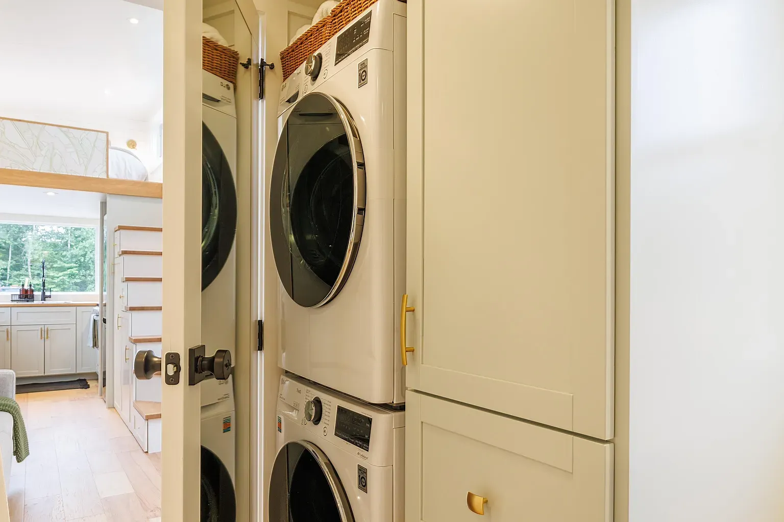 Hidden laundry goals. Stacked set tucked into cabinets it was always there.