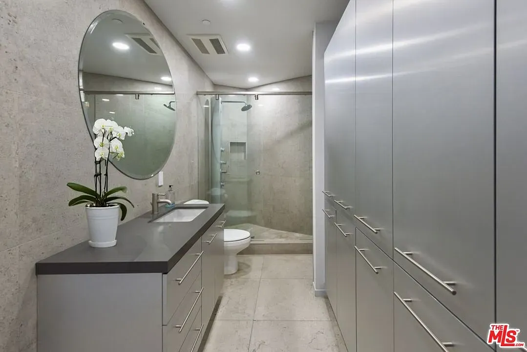 Stone on stone bathroom, super clean lines. Looks relaxing, not cold.