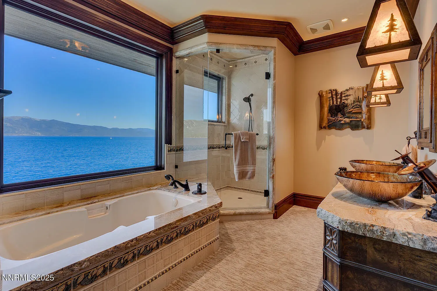 Tub with a view and warm tones. I would actually take baths here.