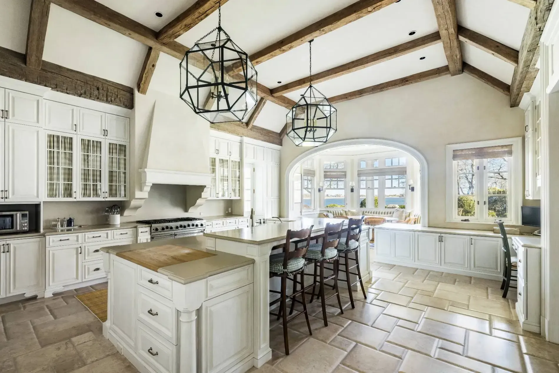 Here's the kitchen—vaulted beams, big island. Rustic but not pretending to be a barn.