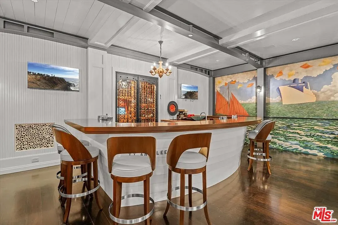 Circular coastal bar. Light wood, white panels, very breezy hangout.