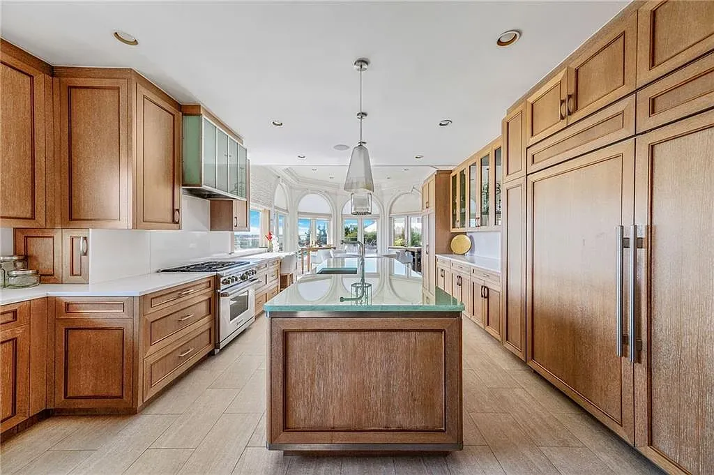 Kitchen's all oak and open. Cozy vibe, plenty of counter space.