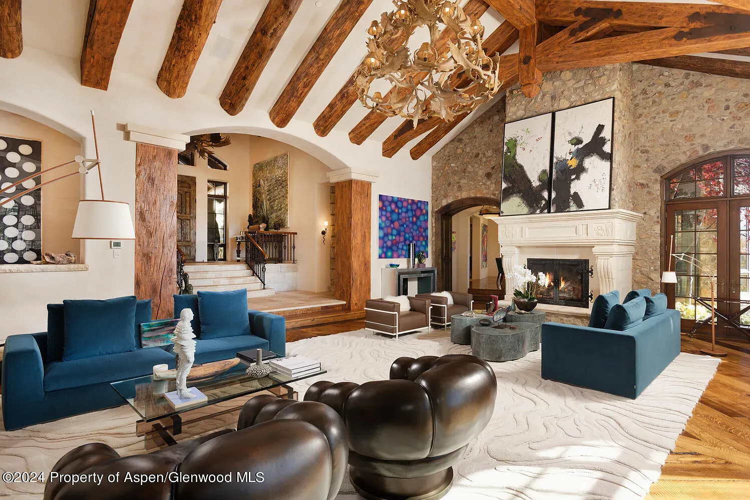 Love the stone accent wall with the beams. Cozy but not dark.