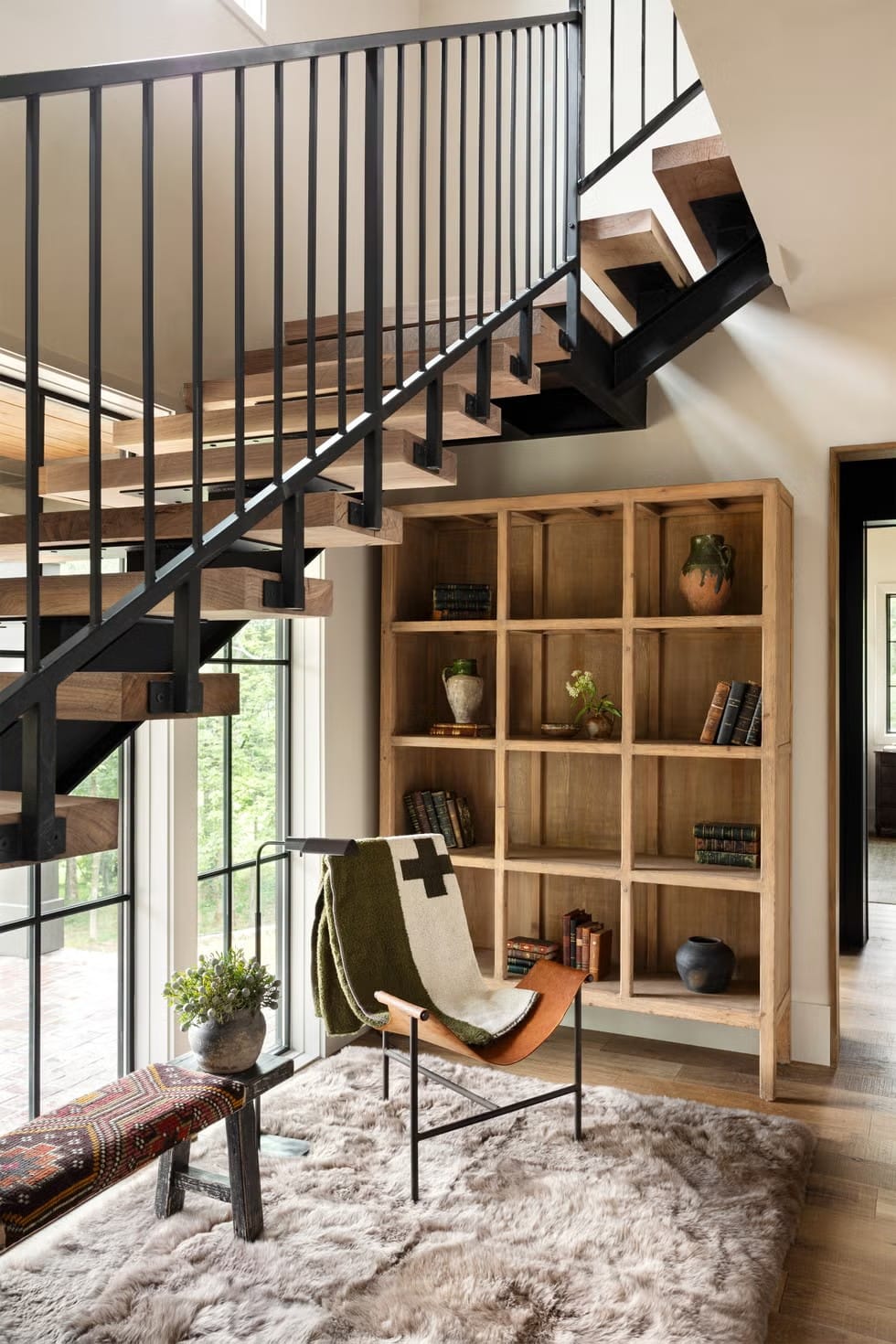 The open-riser staircase looks art and also slightly dangerous in socks.