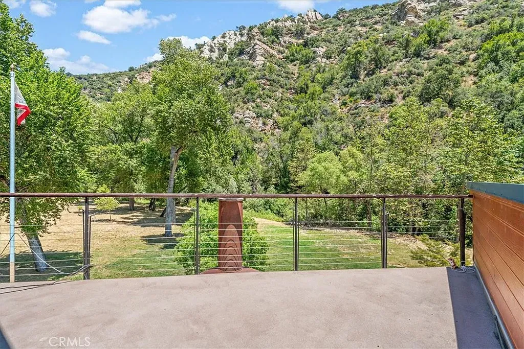 Minimal concrete balcony, all about the view. Calm, quiet, perfect coffee spot.