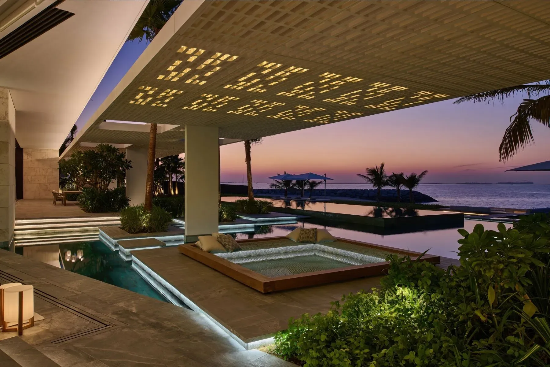 Patterned ceiling throwing cool shadows. Open-air room without walls.