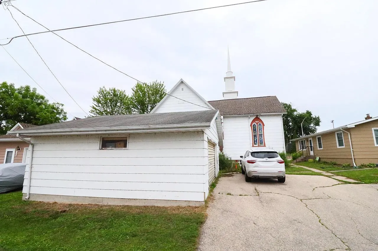 Another angle of the converted church. Those stained glass panels pop against the white.