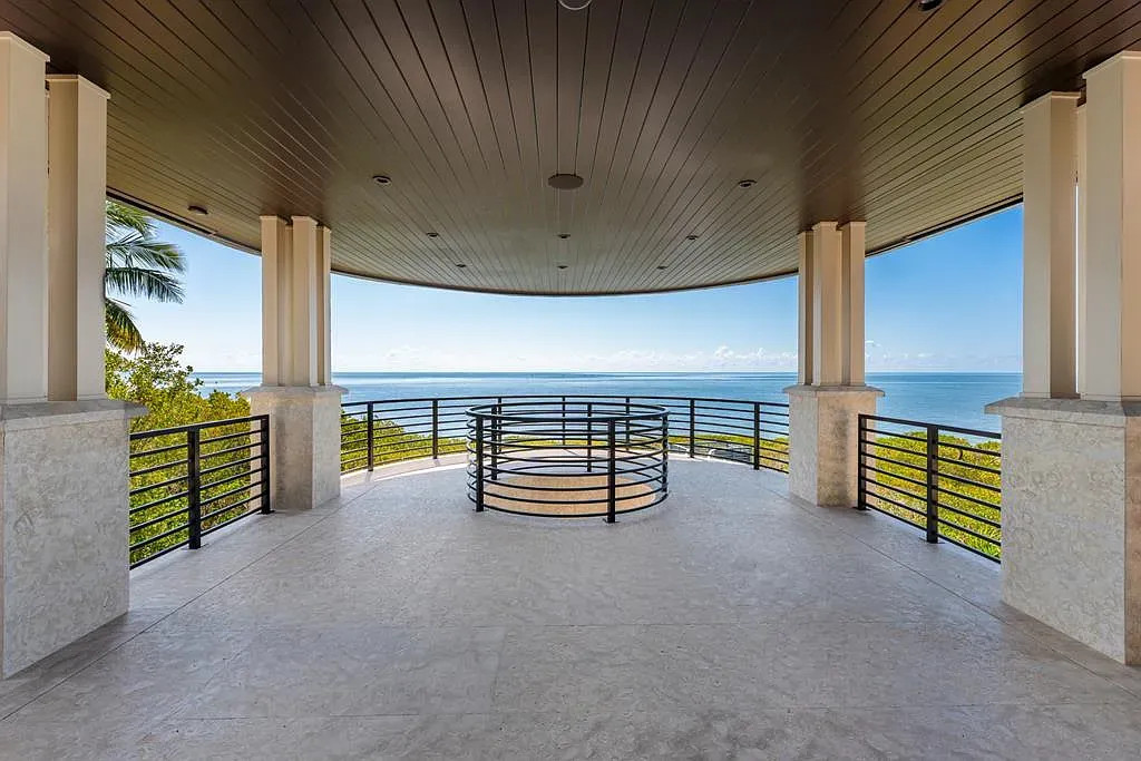 Circular terrace with that dark wood ceiling. Stone floors glowing in the sun.