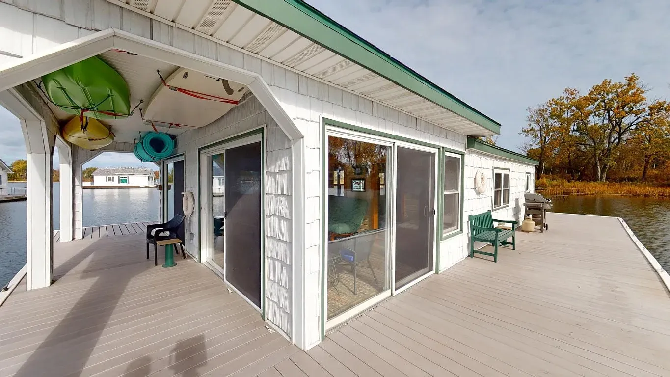 Modern box on stilts, all white. Front-row seats to the water.