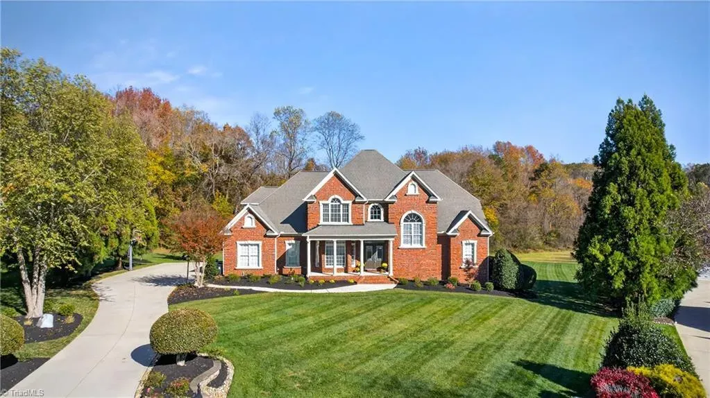 Red brick and arches, classic vibes. The gabled roof is doing the most.