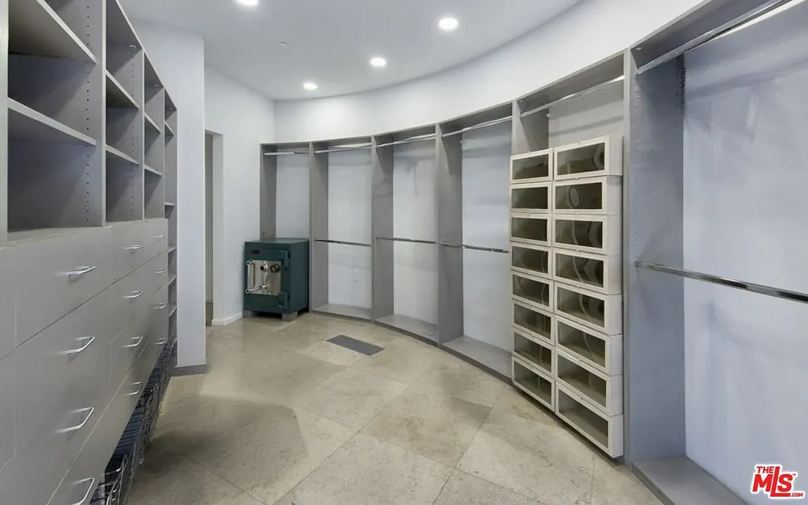 Closet is curved too. Soft tones, big windows, tons of built ins.