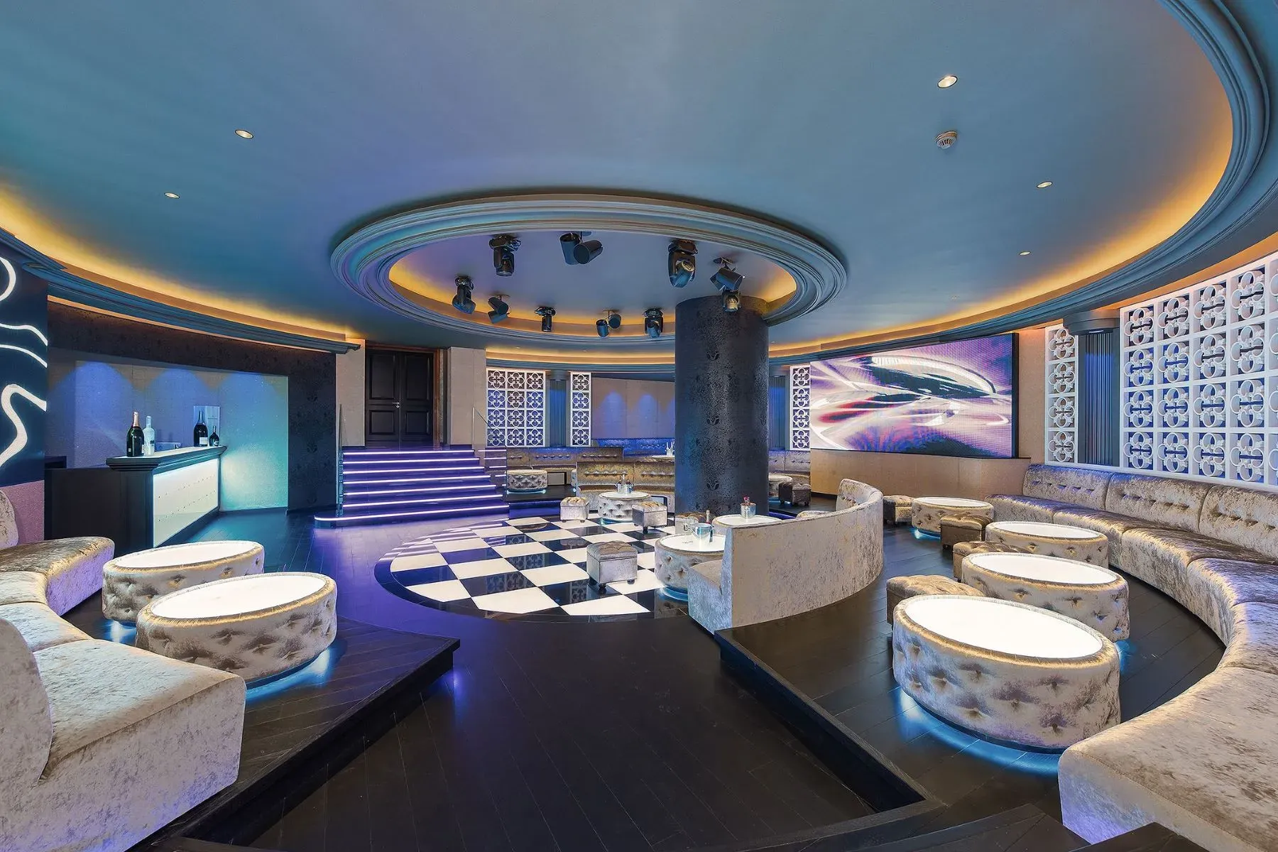 Round bar with soft neon glow. Feels a private club.