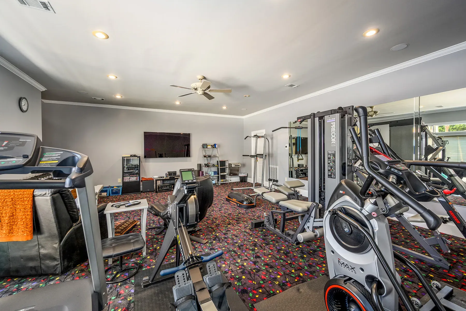 Here's the gym—soft gray, mirrors, lots of space. No excuses.