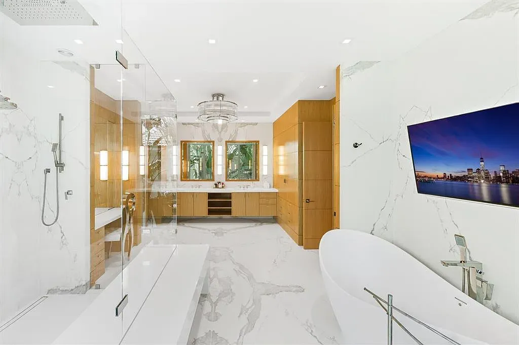 White and wood bathroom with big marble moments. Spa without trying too hard.