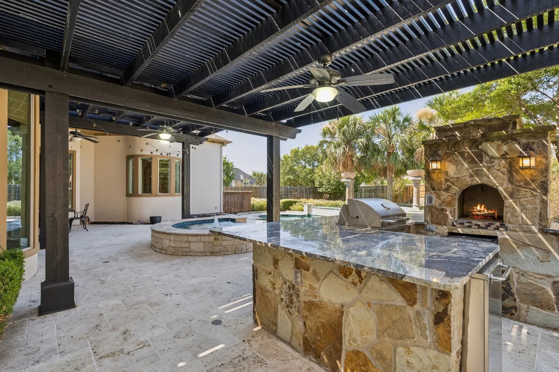 And then the pergola goes bold in black. Looks ready for long dinners.