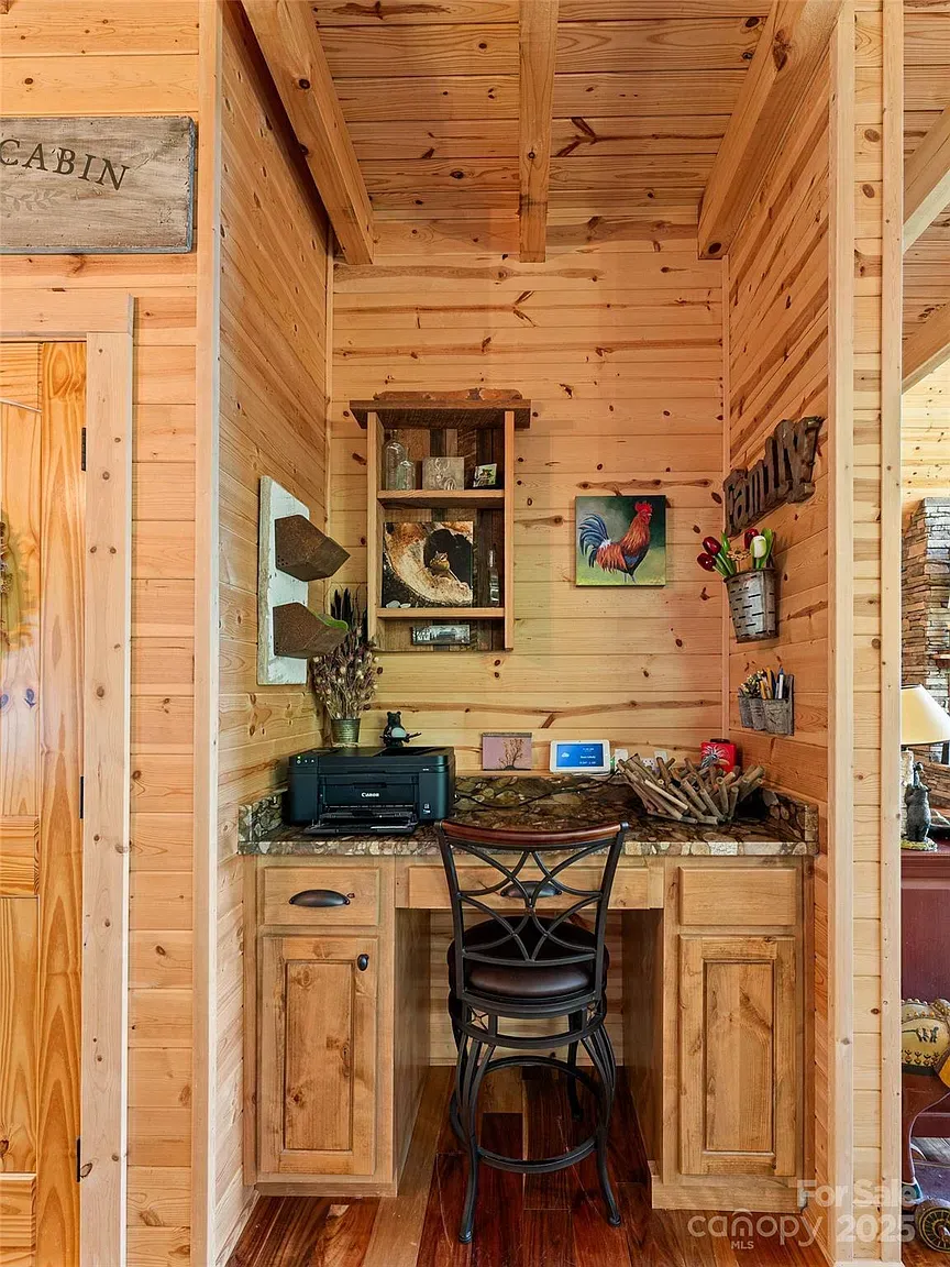 Little work nook tucked under beams. Laptop, coffee, disappear for hours.