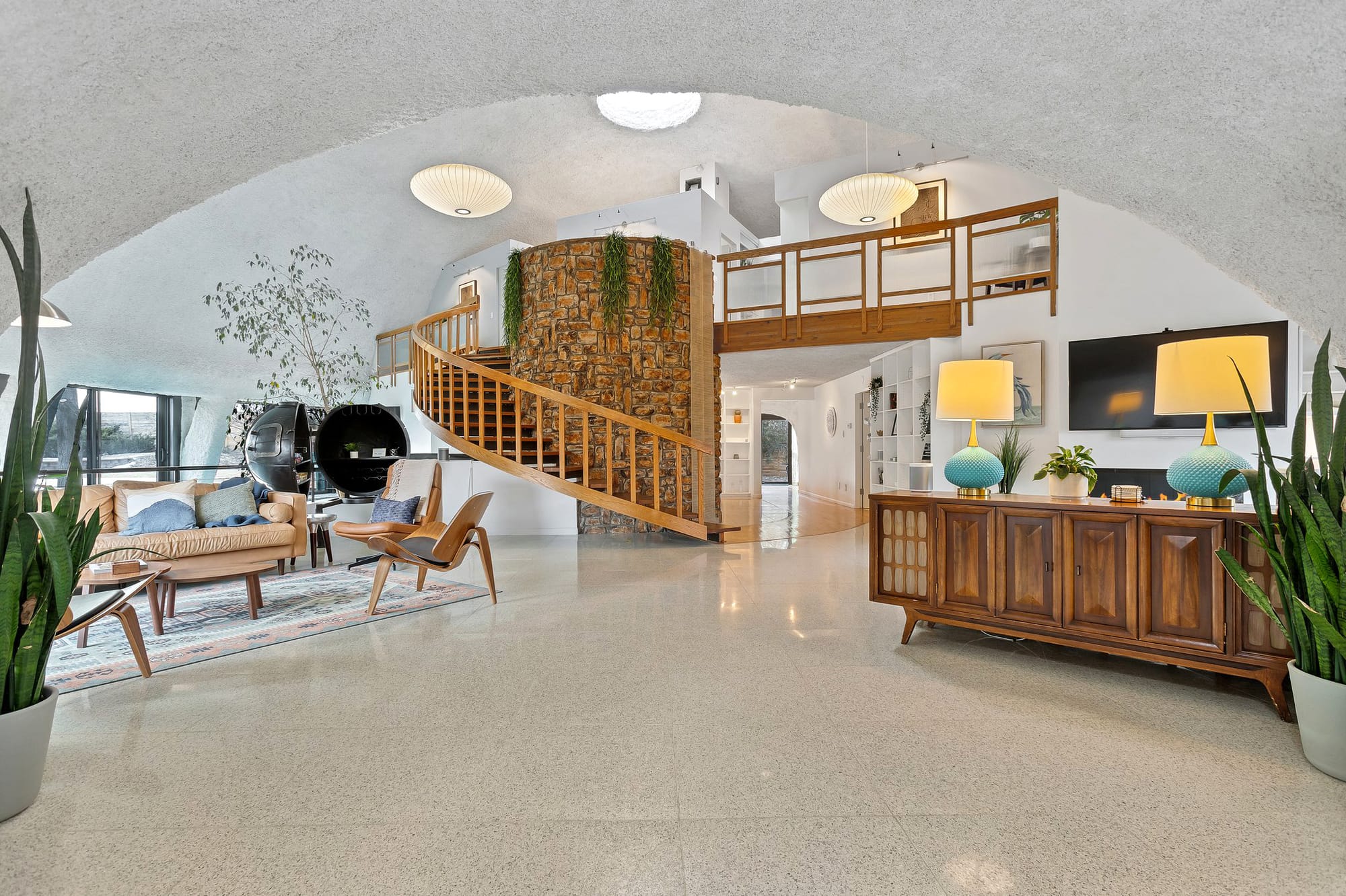 Inside is all arches and light. Terrazzo floors look glossy and warm.
