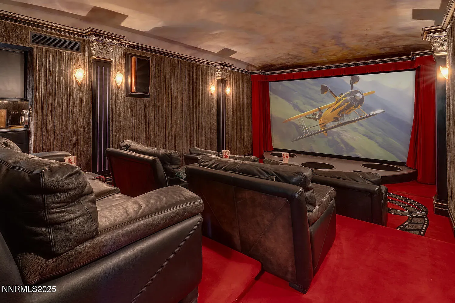 Tiered leather throne room for popcorn. I would never leave this cave.