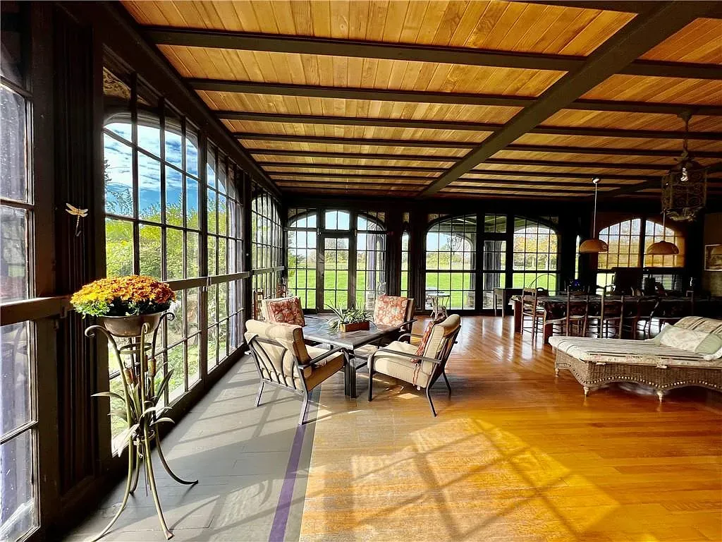 Wall of windows. Beamed ceiling plus sunshine equals instant nap zone.