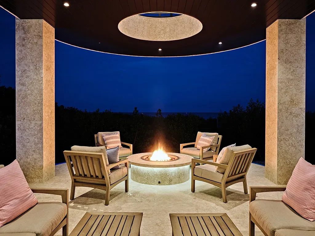 Fire pit on the circular terrace. Four chairs, zero bad stories here.