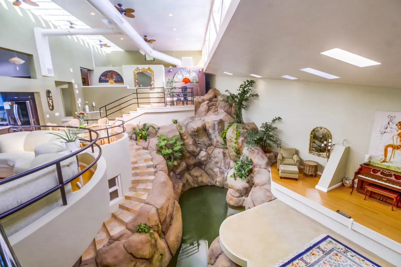 Wait, that's an indoor waterfall pouring into a pool. Wild.