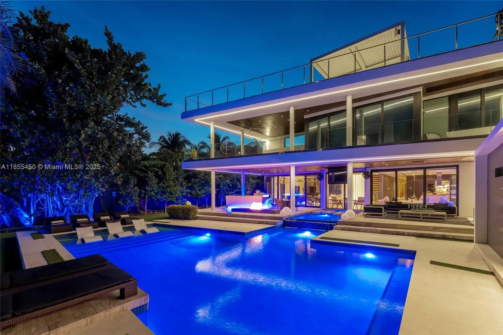 Here’s the front at dusk—glass walls glowing, rooftop terrace peeking.