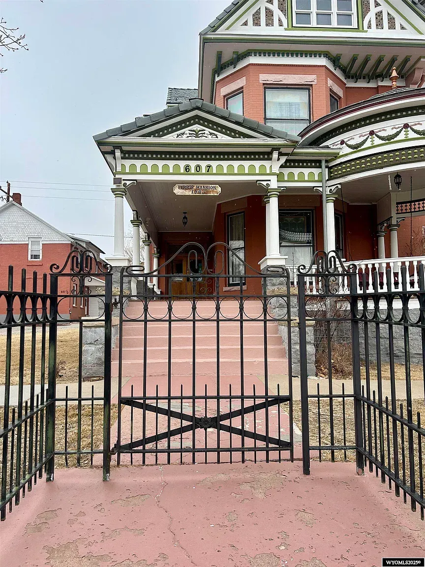 Another exterior shot—peach brick with green trim. That turret keeps stealing scenes.