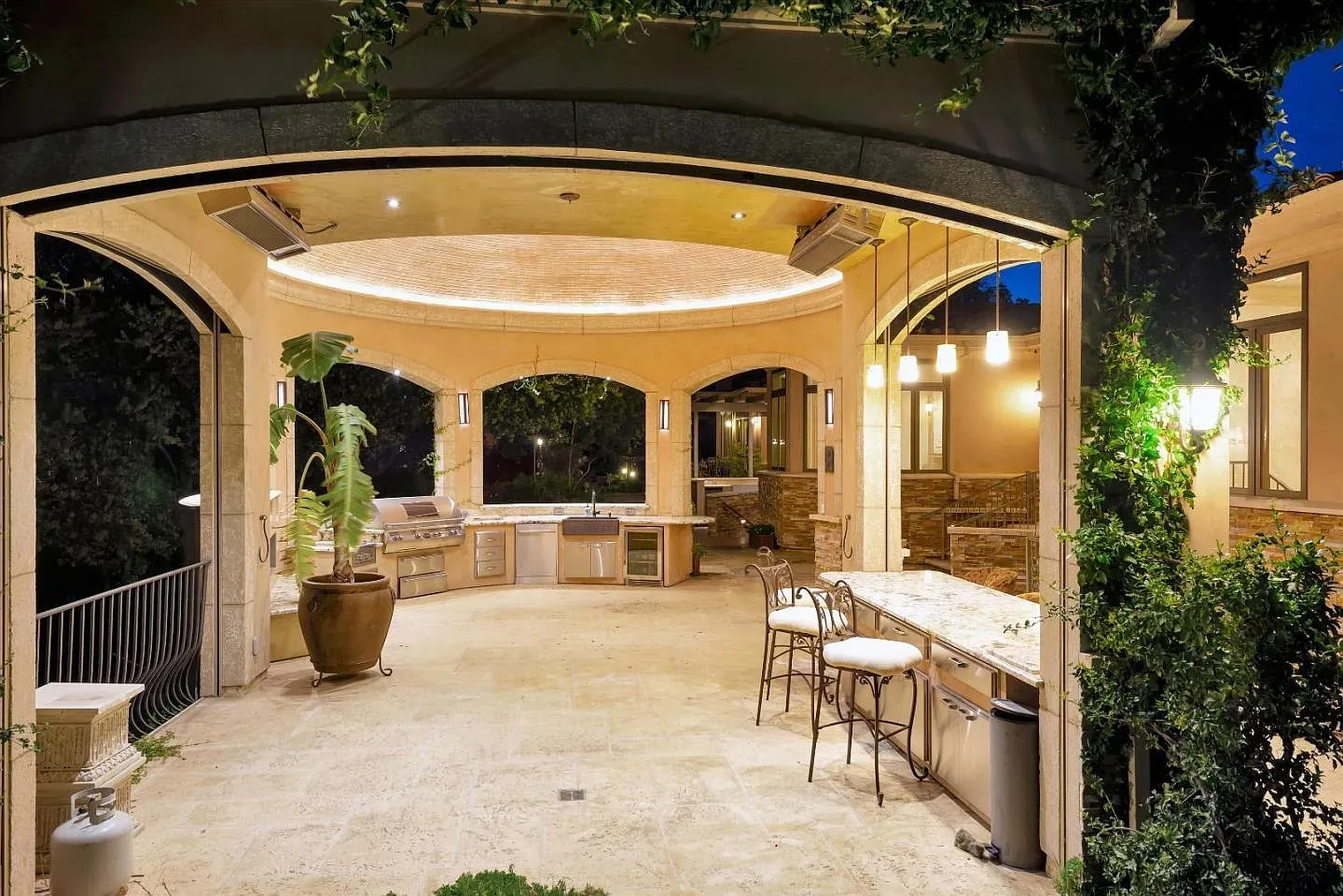 Outdoor kitchen goals under that pergola. I can already hear the sizzle.