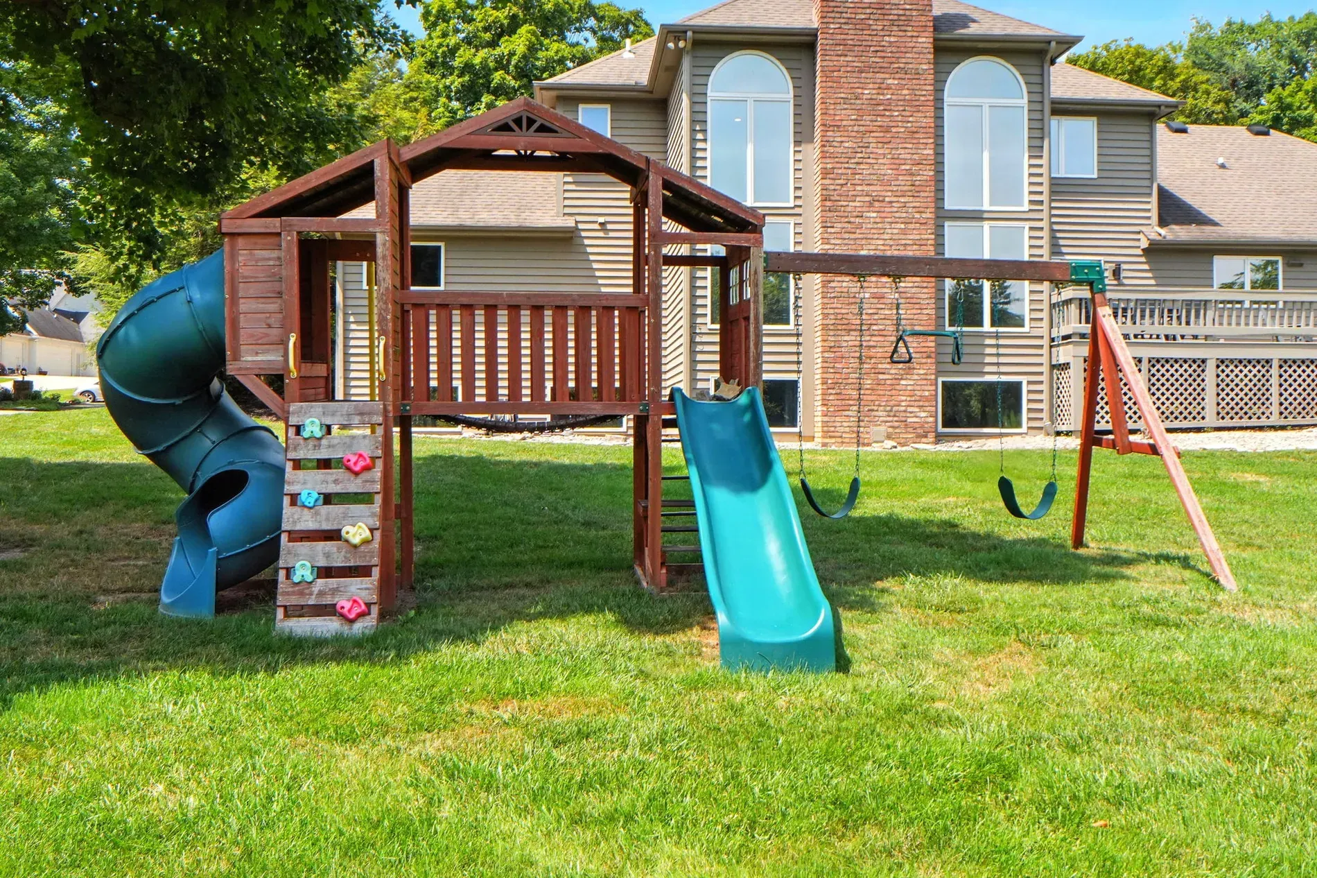 Playset included. Kids win, grass loses. Anyone reseed around these successfully?