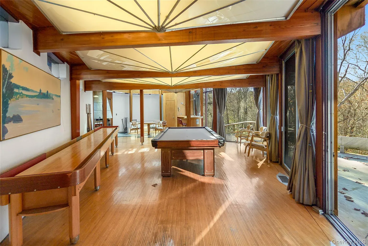 Game room under a giant umbrella ceiling. Light for days.