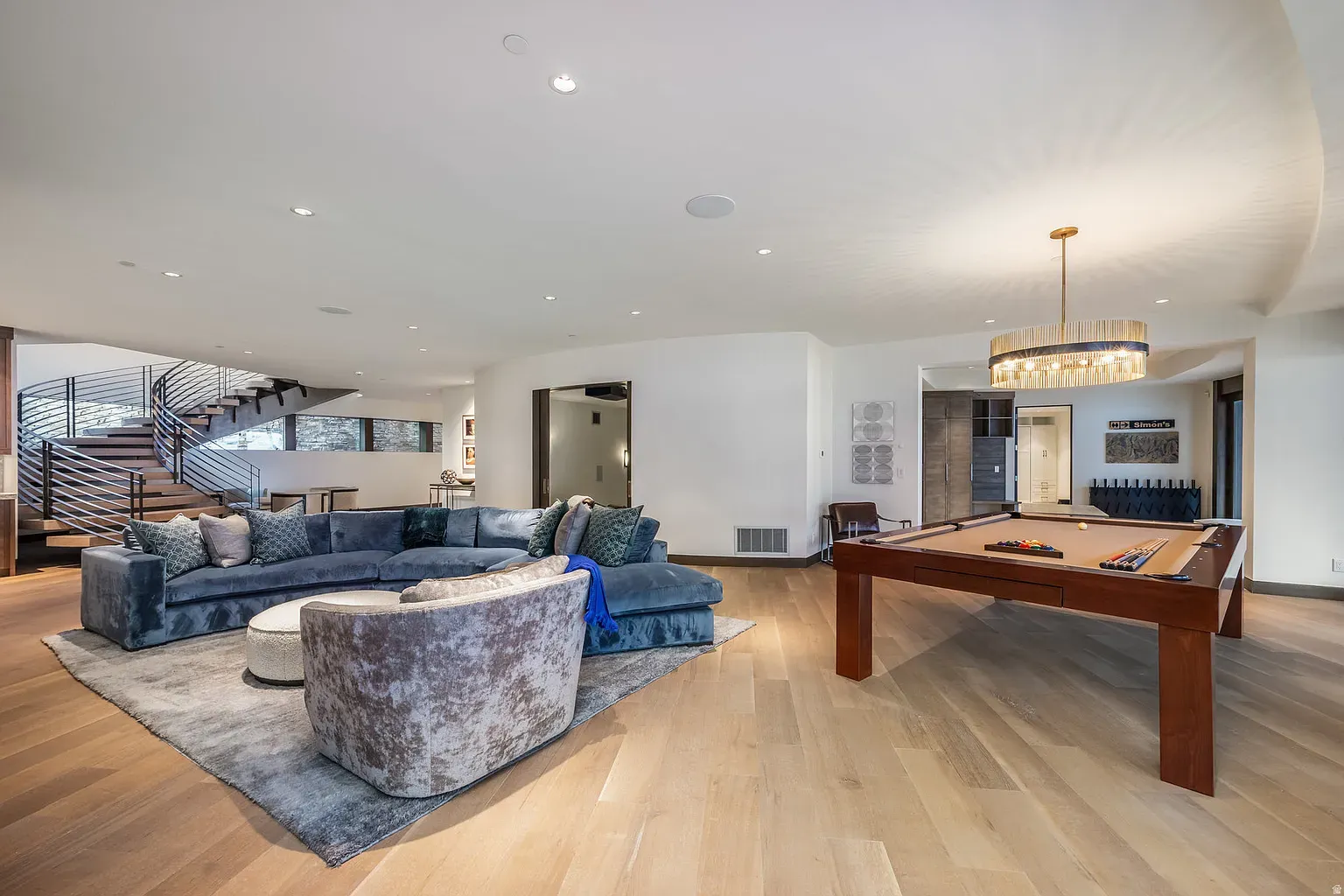 Clean game room. Pool table as sculpture, lots of room to miss shots.