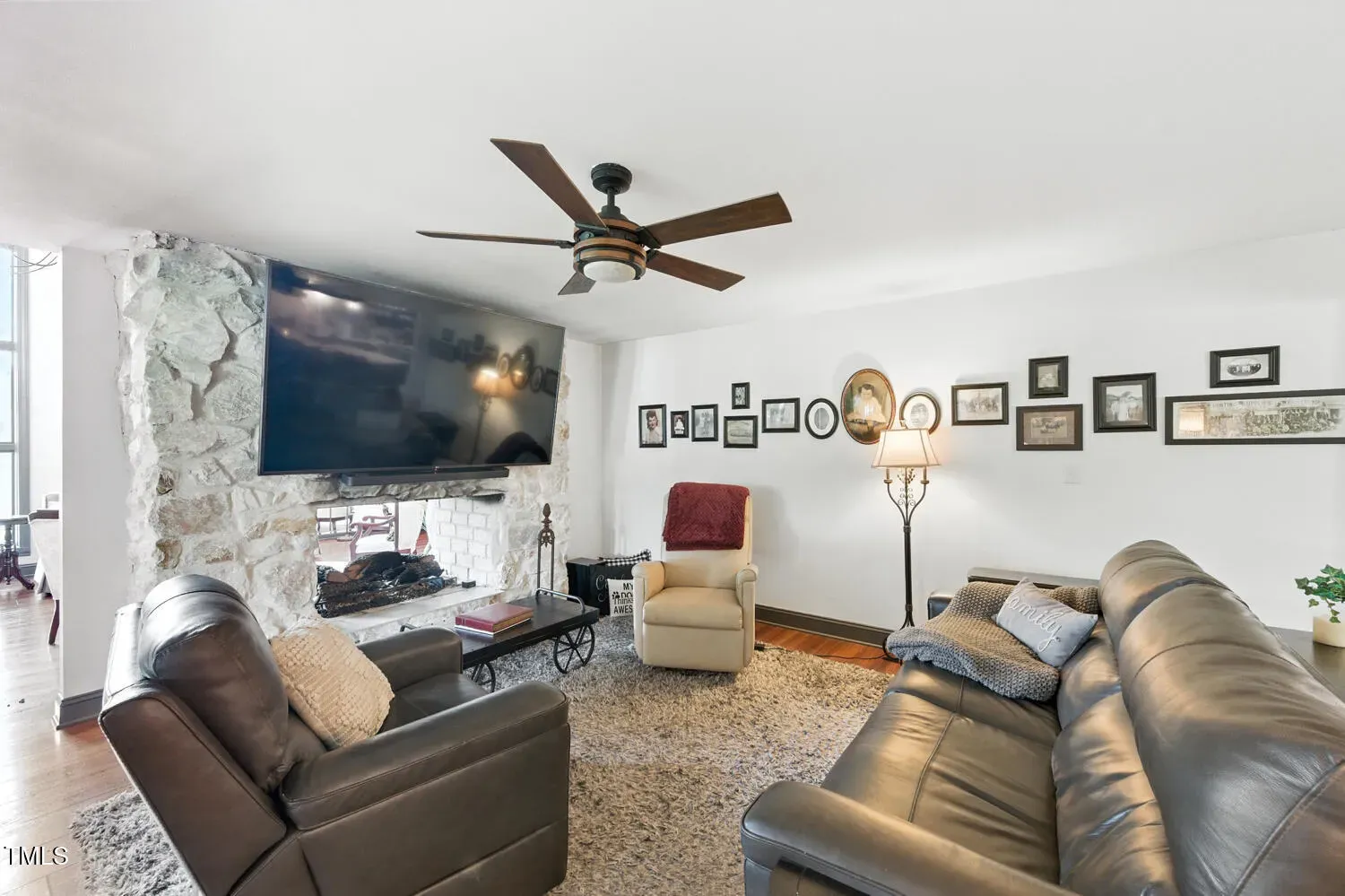 TV over stone fireplace. Cozy, but neck strain? I’ll risk it.