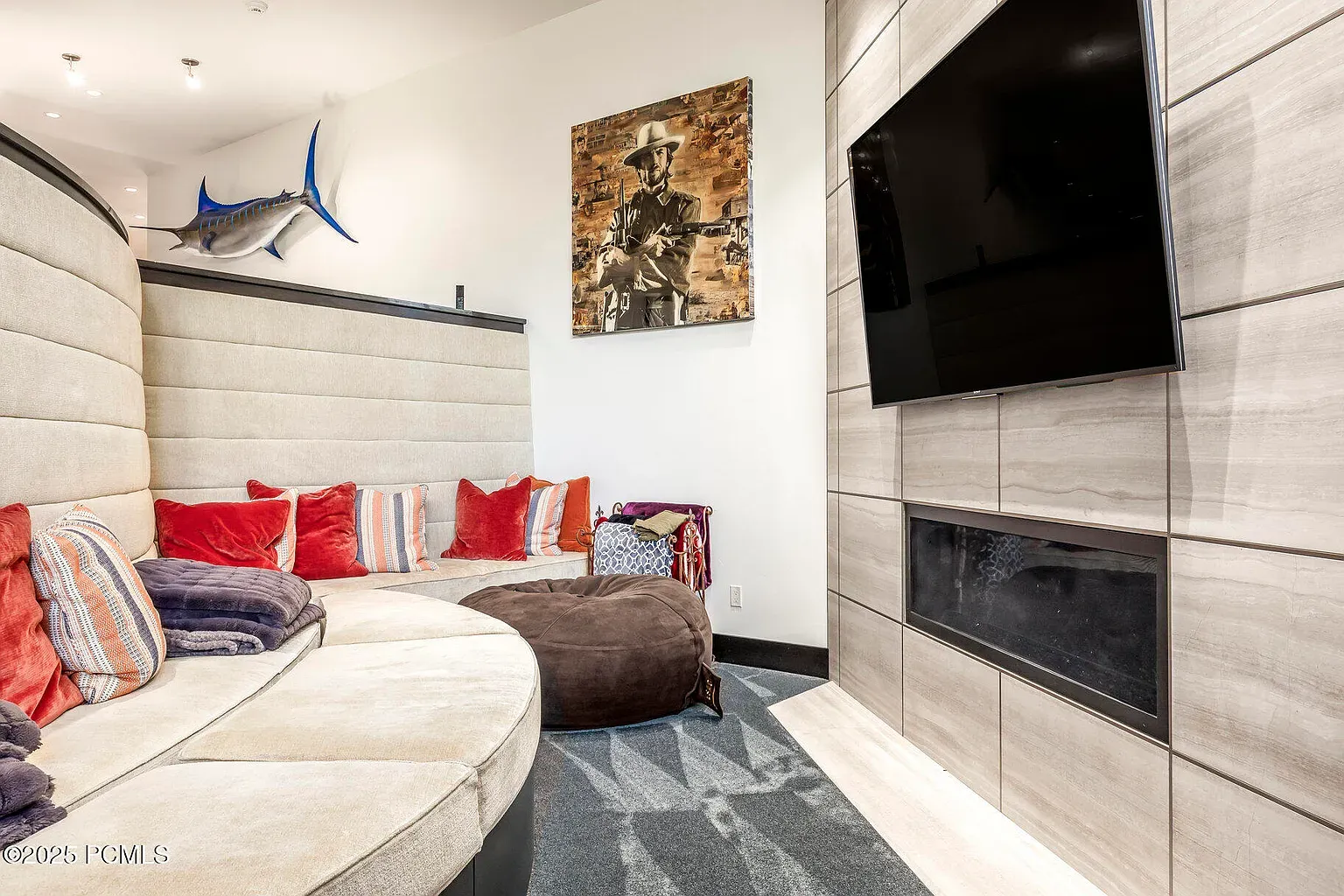 Curved sectional for the win, but red pillows—too loud or just right?