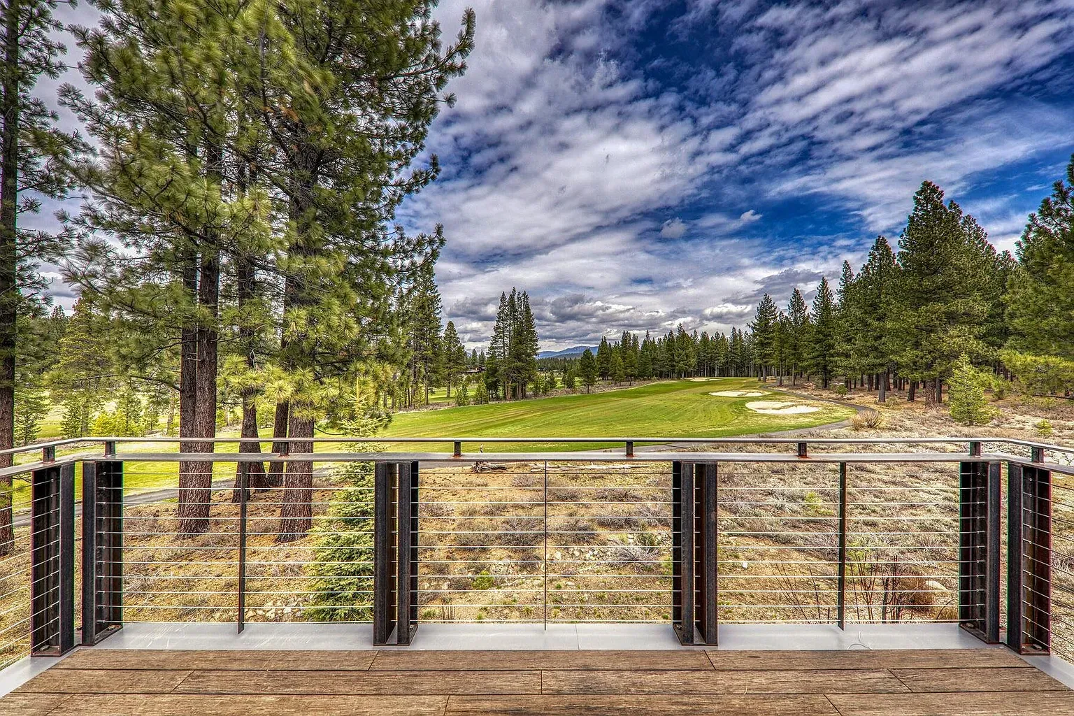 Balcony over the fairway. Glass railing means no lost view of that green.
