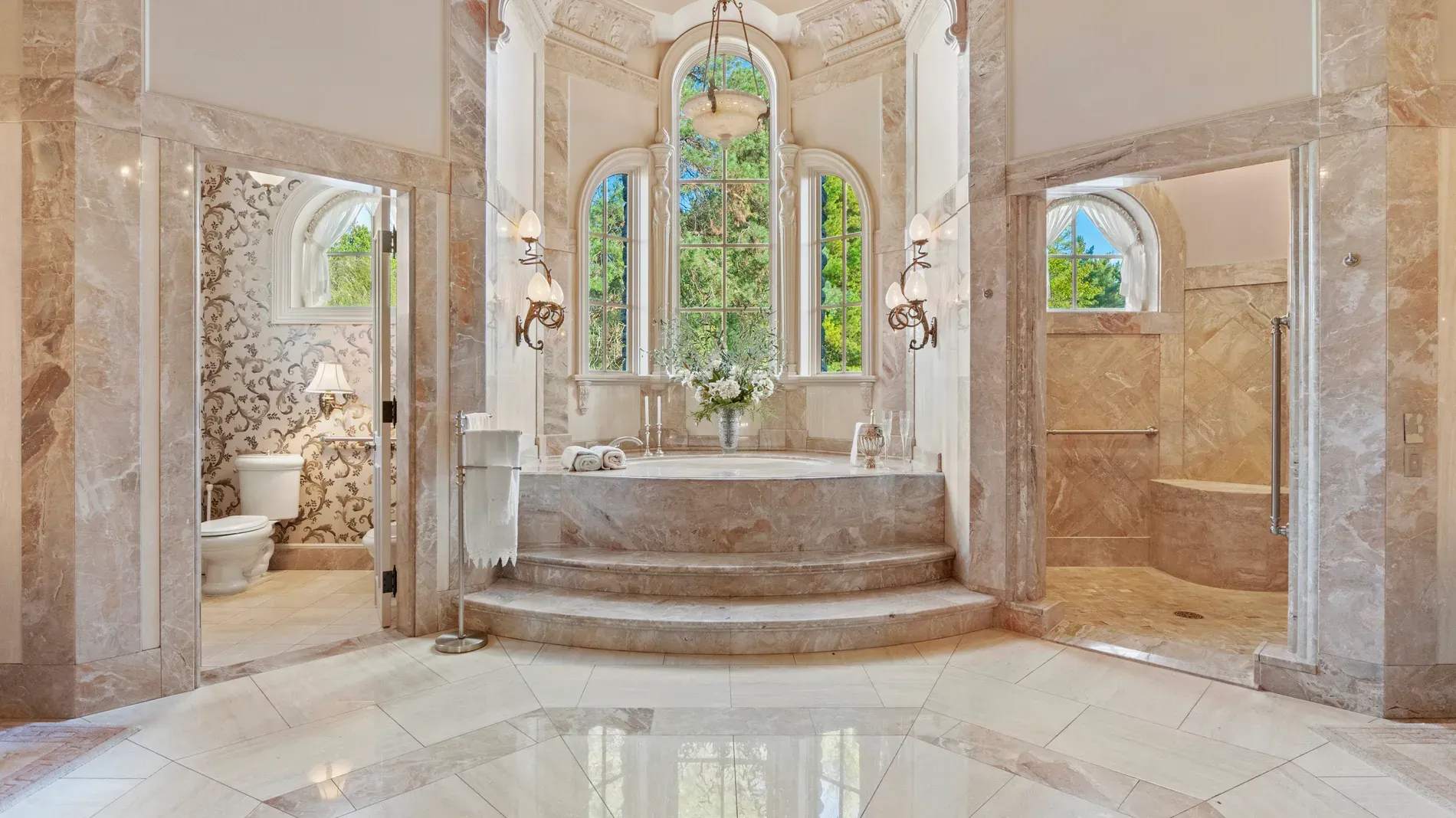 Marble-on-marble bathroom with a center-stage soaking tub. Okay, wow.