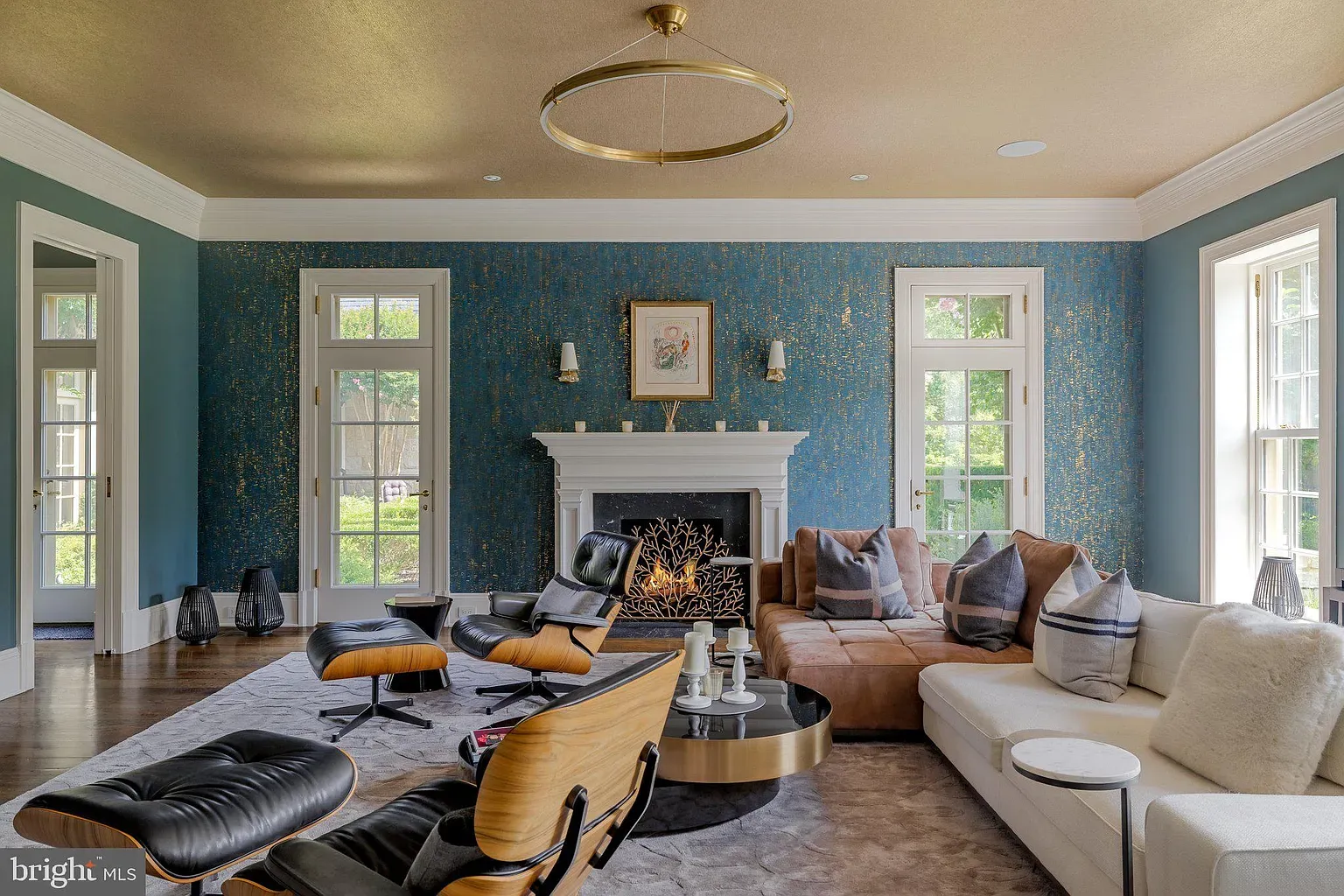 Teal and textured gold wallpaper. Fancy hotel vibes, but sunny.