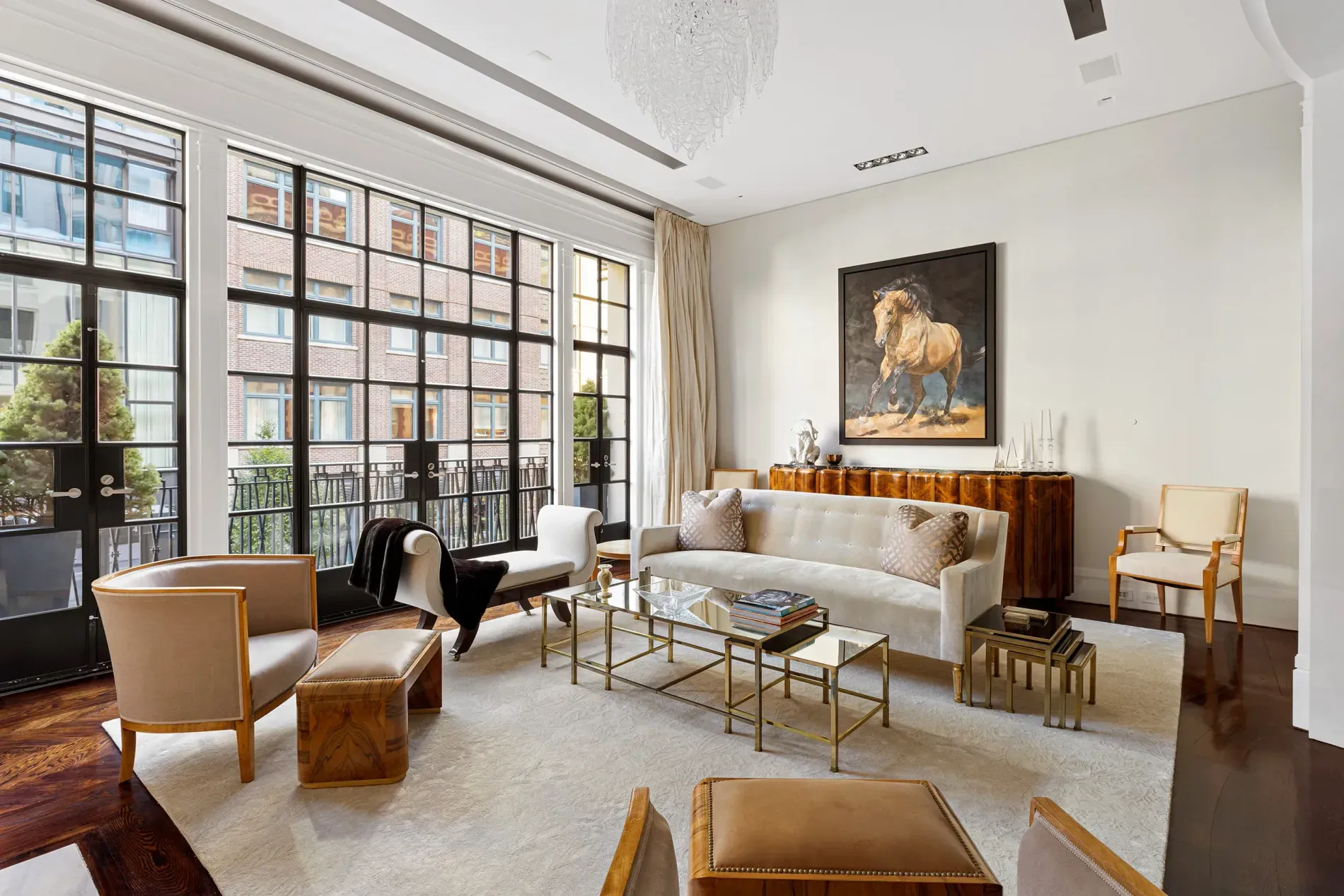 Here's the living room—huge windows, soft neutrals, all light and airy.