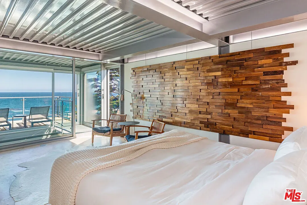 Waking up to that balcony and ocean hit would ruin me.
