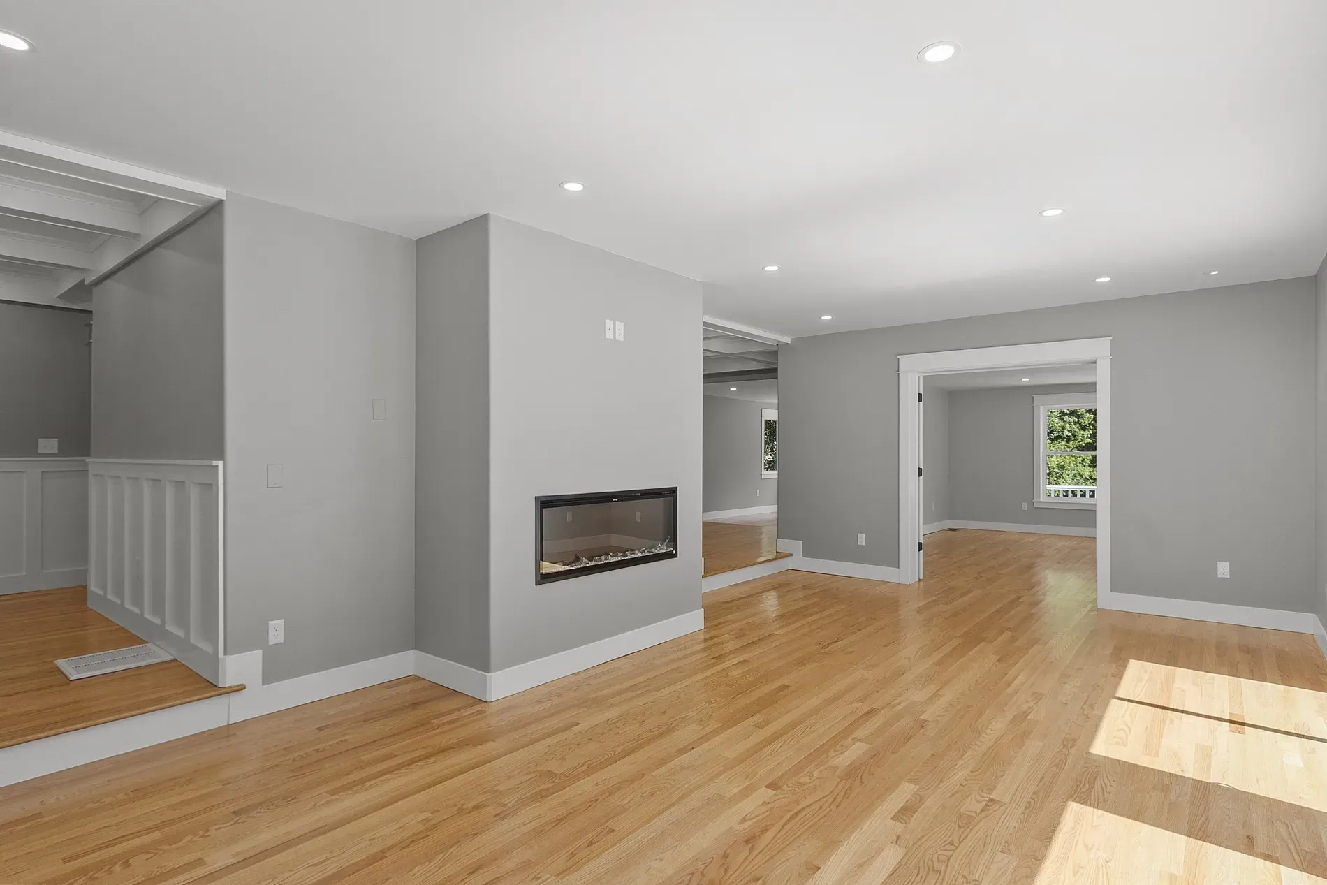 Big open room, cool gray walls, those windows make it feel easy-breezy.