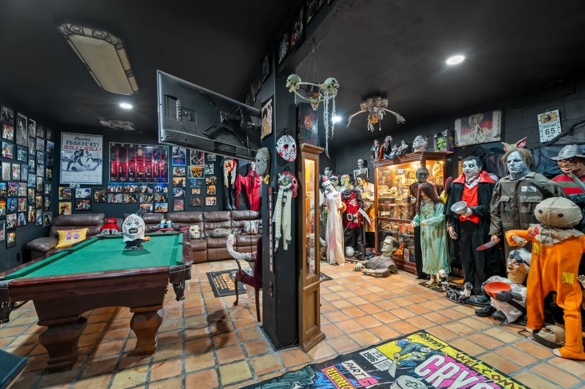 Horror poster museum wall-to-wall. Black paint makes everything pop and also terrifying.