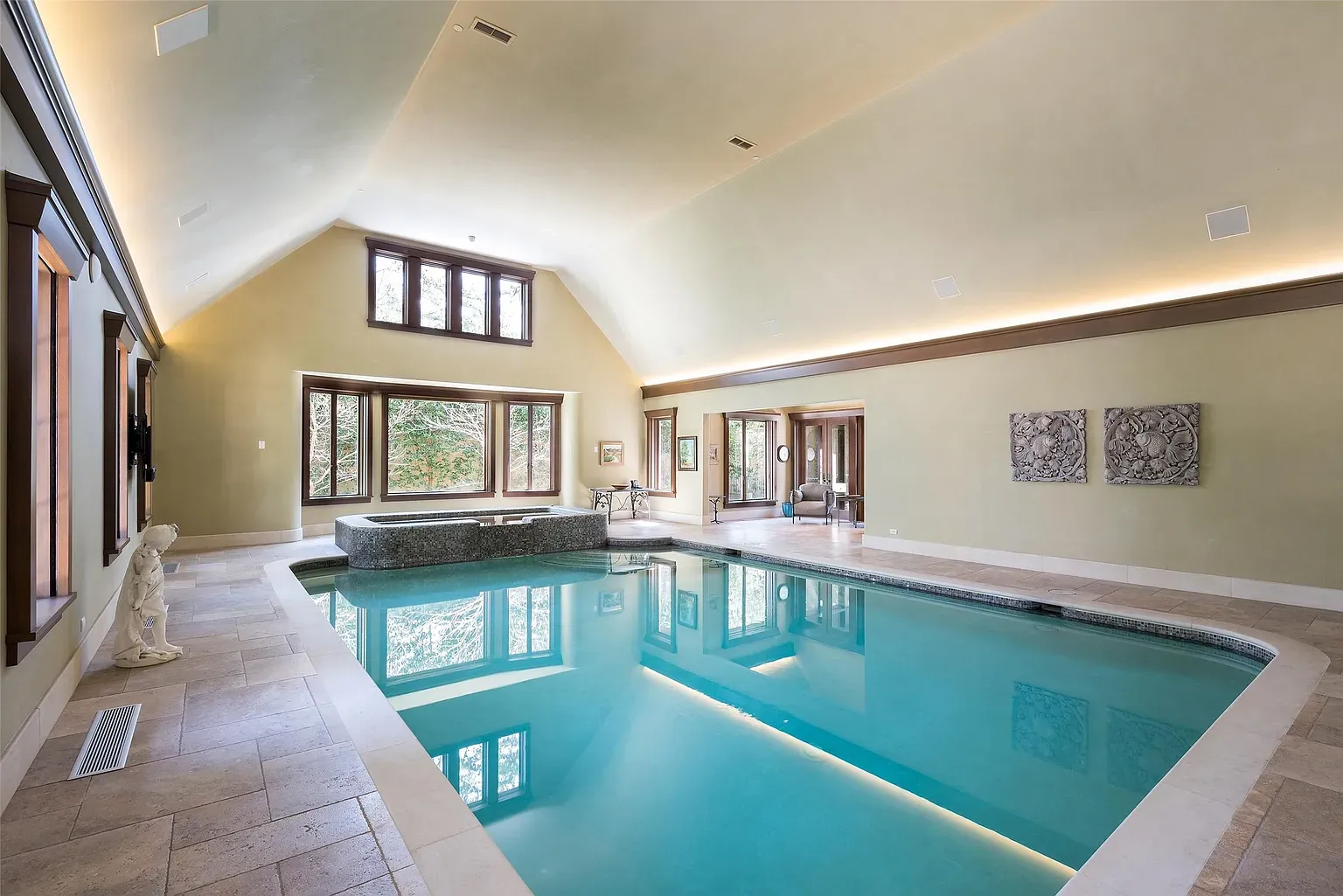 Indoor pool flex. Vaulted ceilings and those windows make it feel resort-y.