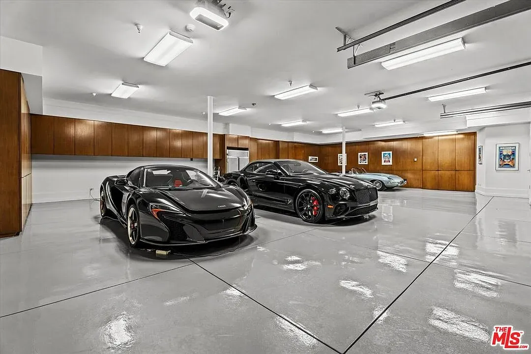 Pristine garage lineup. McLaren and friends. Floors shinier than my future.