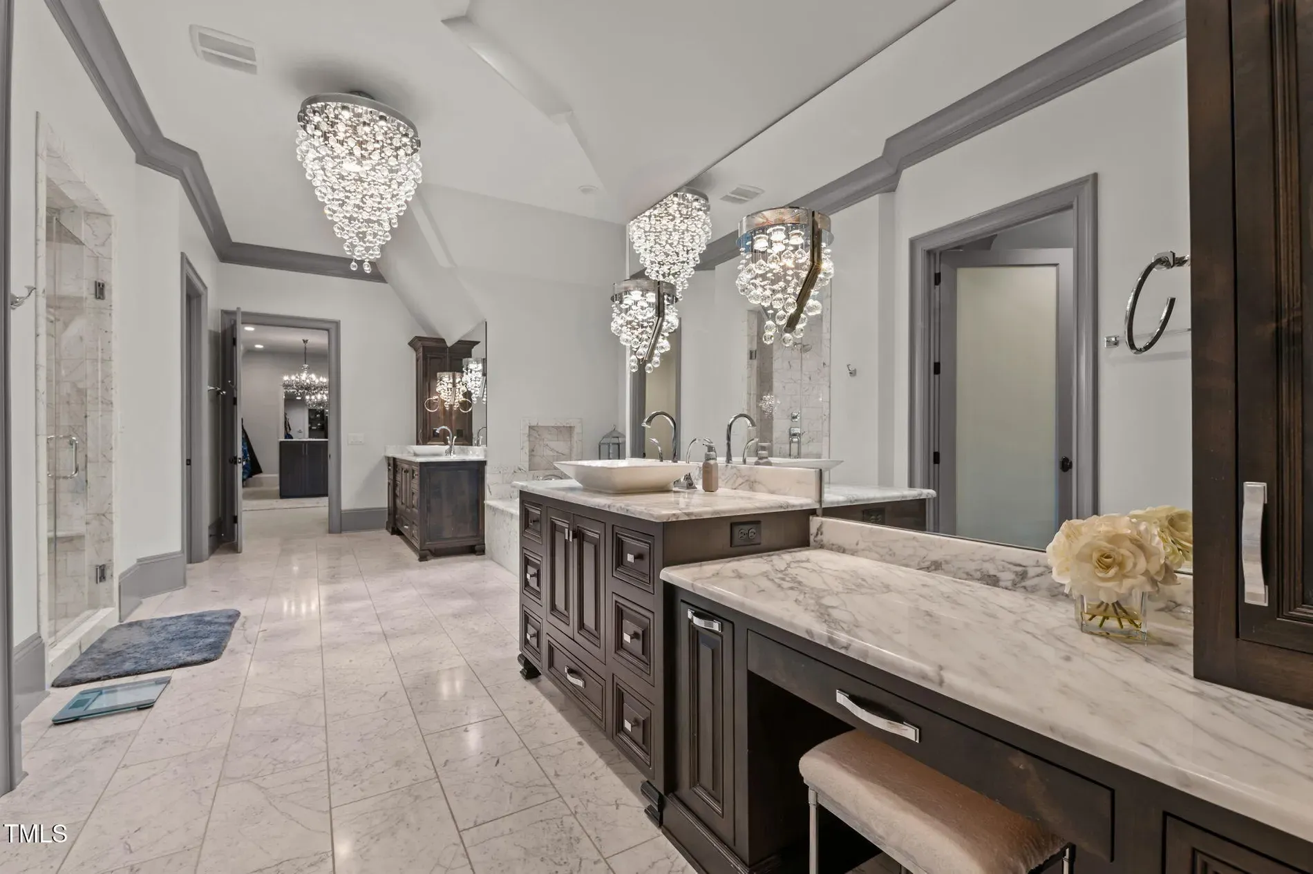 Bathroom goes full marble. Looks icy-cool, probably echoes when you sneeze.