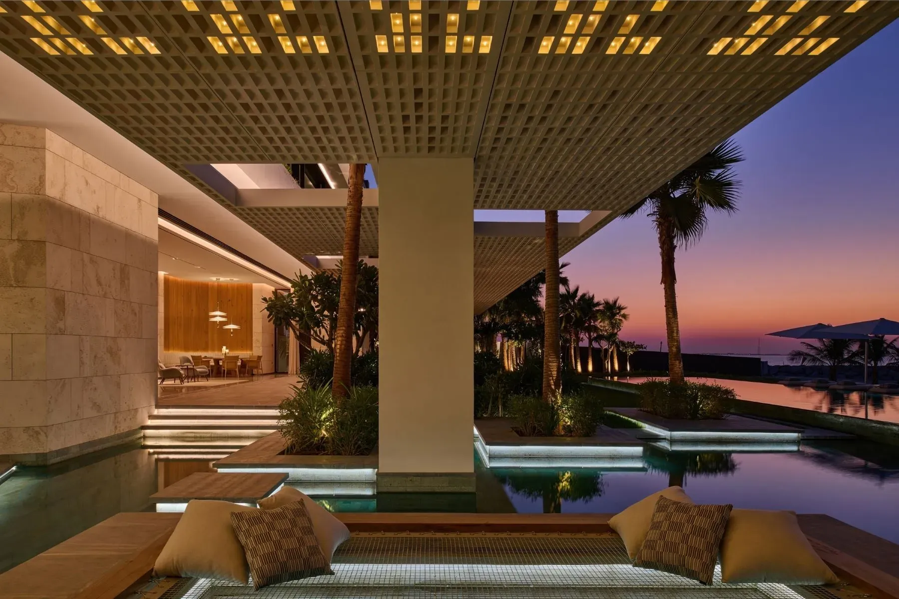 Under the grid canopy, everything’s dappled and calm. Coastal soundtrack included.