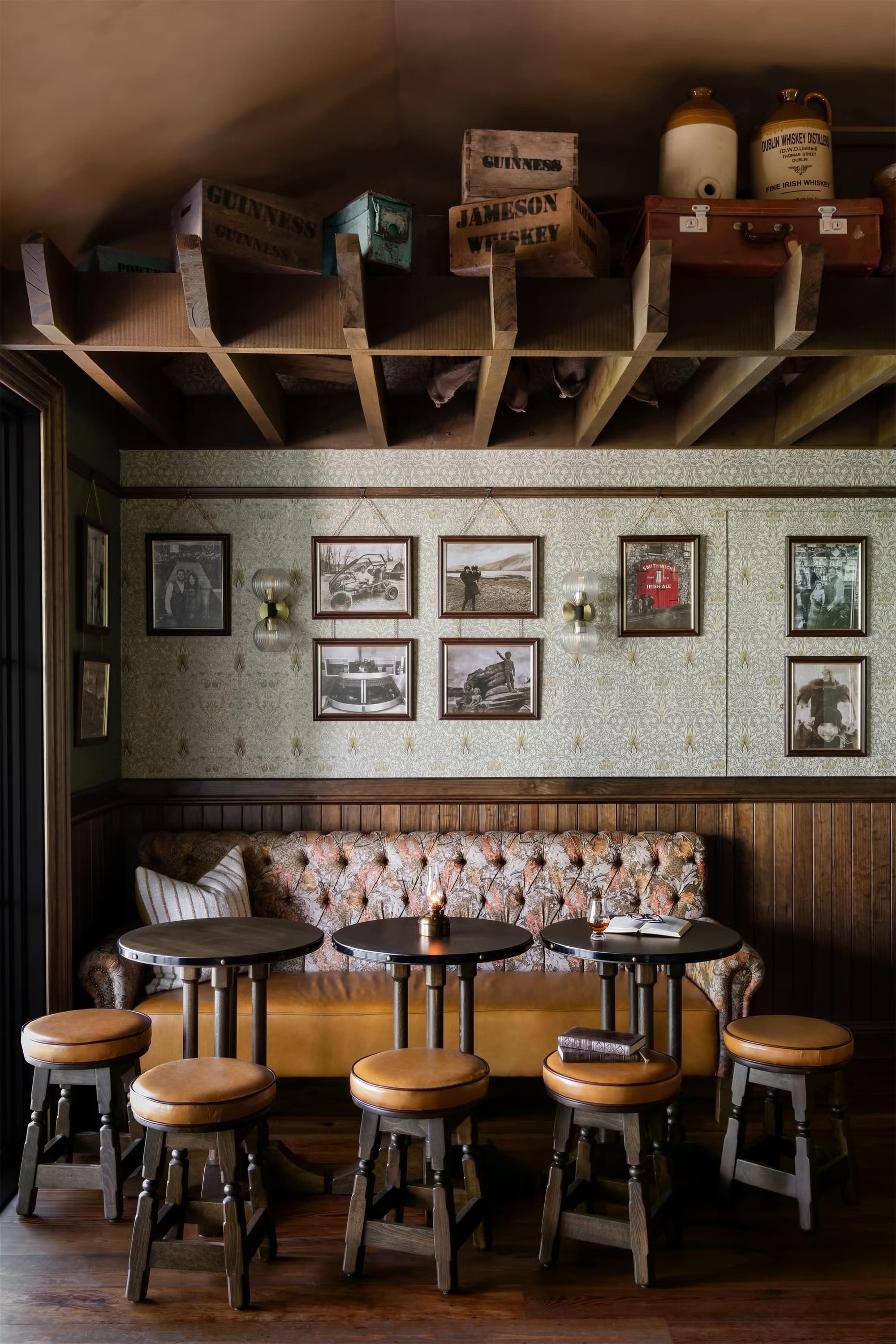 Little pub corner with the tufted banquette—yes, please, long stories and snacks.