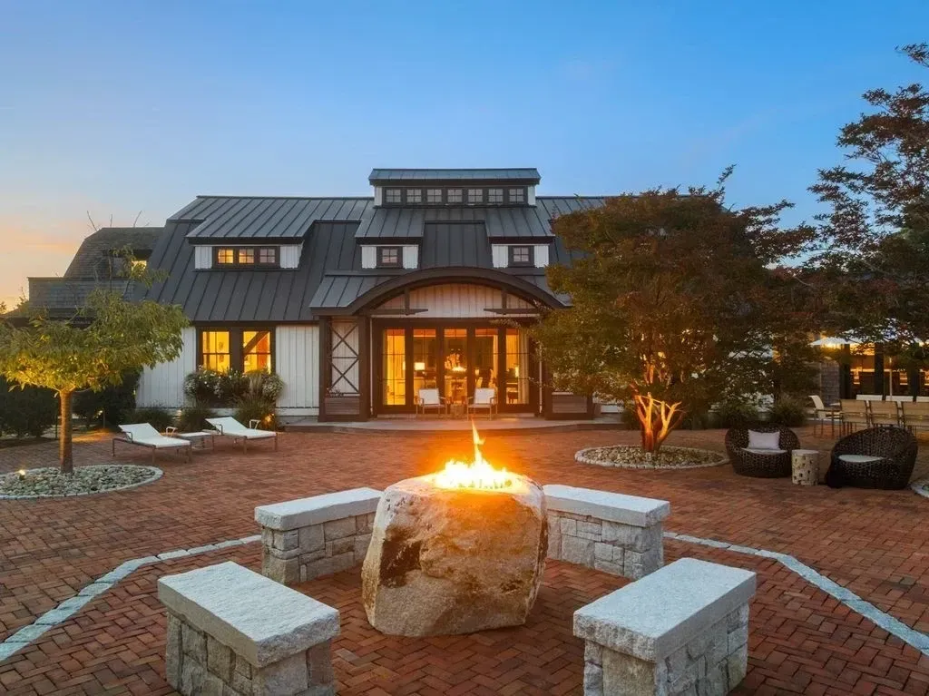 Big stone fire pit with rock stools. I can hear crackling already.