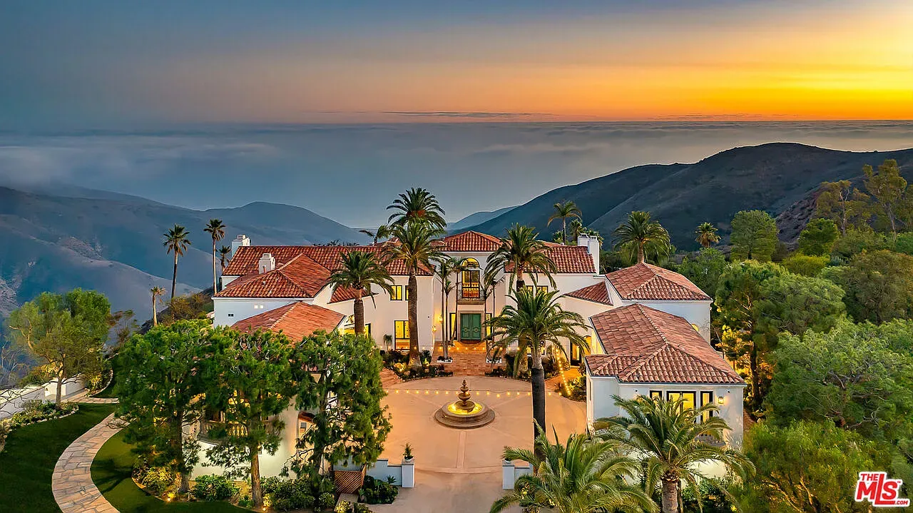 Sunset over terracotta and white stucco. Classic Mediterranean, looks postcard-ready.